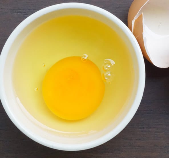 cracked egg in a ramekin