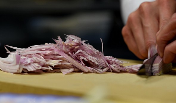 cutting red onion