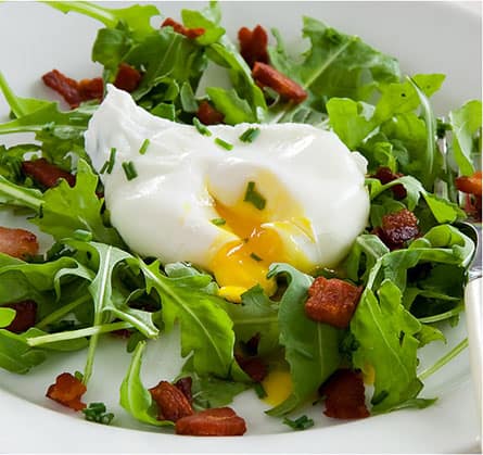 poached egg on salad greens