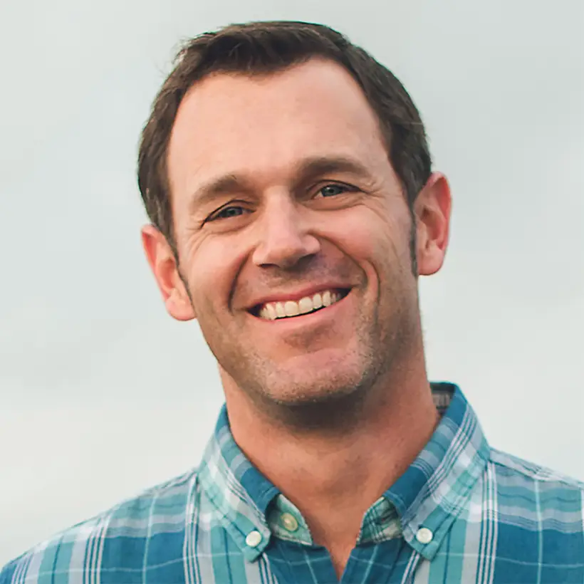 Egg farmer in plaid shirt